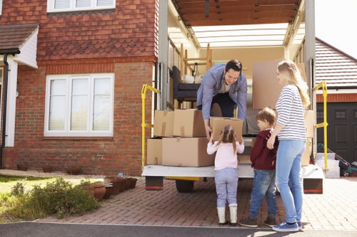 Moving team supporting a home move in Whitechapel with boxes and furniture