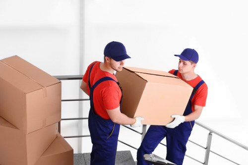 Removal team supporting a Whitechapel home move with boxes and furniture