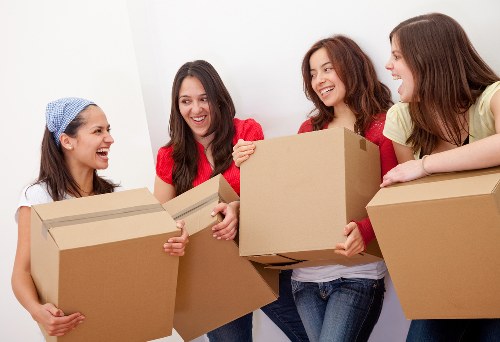 Removal team handling a home move in Whitechapel street surroundings