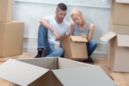 Packed office boxes and furniture ready for removal in Whitechapel