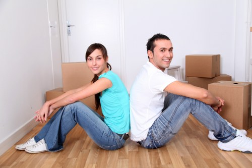 Removal team planning a move on a busy Whitechapel street