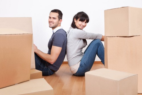 House movers delivering furniture and boxes to a Whitechapel property