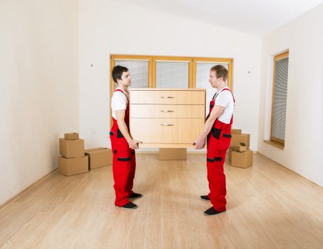 Carefully packed equipment and labelled items for a local business relocation